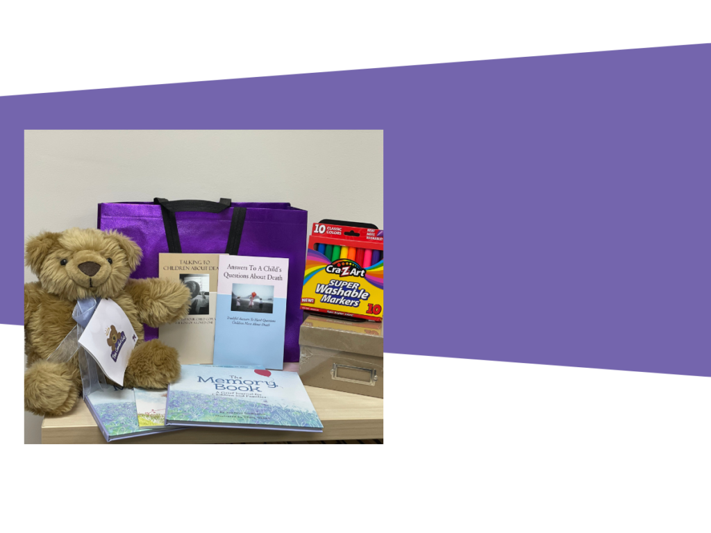 A teddy bear sits beside a stack of books and a purple bag, creating a cozy and inviting reading atmosphere.